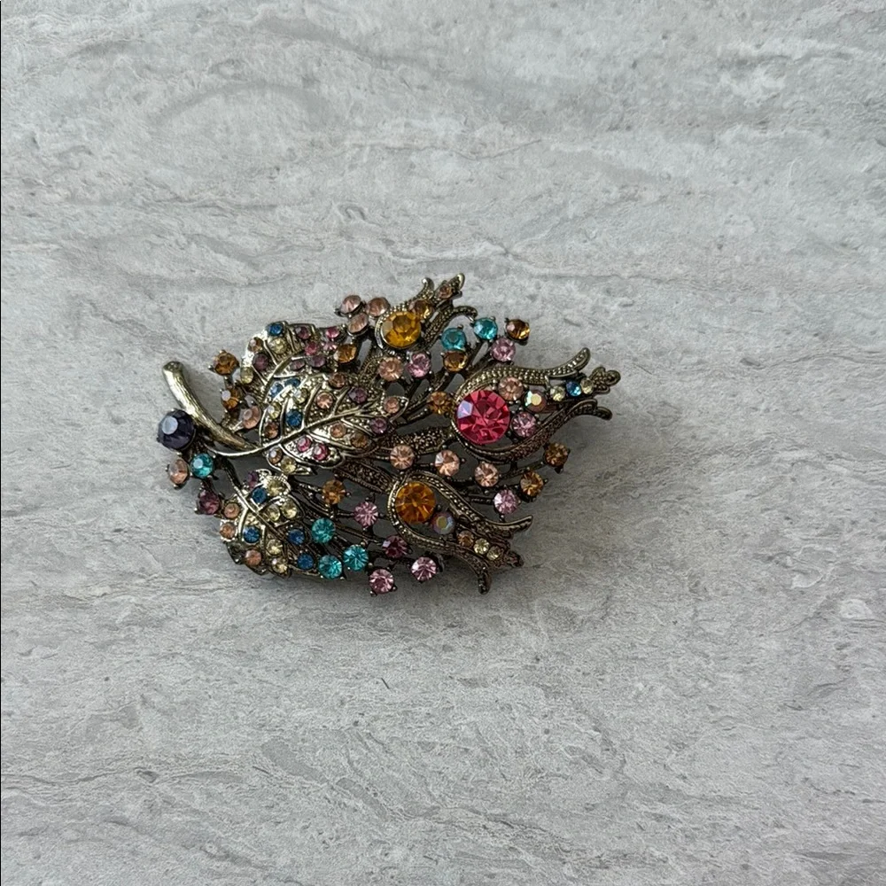 Ornate Pink and Blue Brooch with Intricate Metalwork - Picture 1 of 4